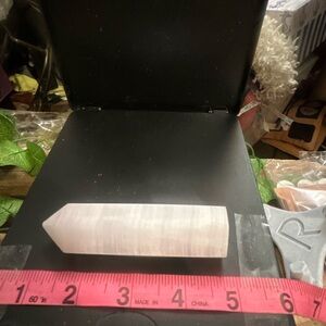 Pink Mangano Calcite Tower glows Pinkish orange